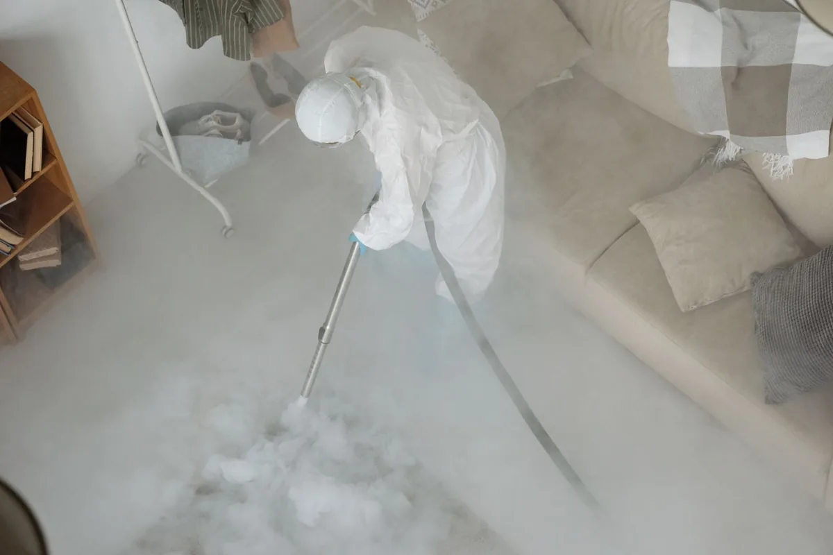 Biohazard cleanup technician in protective equipment, Van, TX
